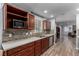 Updated kitchen boasts wood floors, quartz countertops, stainless steel appliances, and open layout at 2617 Mason Ave, Las Vegas, NV 89102