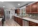 Spacious kitchen features stainless steel appliances, quartz countertops, and a stylish tile backsplash at 2617 Mason Ave, Las Vegas, NV 89102