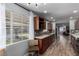 Updated kitchen boasts wood floors, quartz countertops, stainless steel appliances, and view of the pool at 2617 Mason Ave, Las Vegas, NV 89102