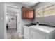 Well-equipped laundry room with modern washer and dryer, ample storage, and clean design, making laundry a breeze at 2617 Mason Ave, Las Vegas, NV 89102