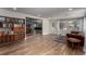 Expansive living area features hardwood floors, seamlessly connecting to a dining space, and a comfy sofa, ideal for gatherings at 2617 Mason Ave, Las Vegas, NV 89102