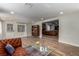 Spacious open-concept living area with hardwood floors, comfortable seating, and access to other living spaces for easy entertaining at 2617 Mason Ave, Las Vegas, NV 89102