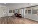 Bright living room boasts hardwood floors, an inviting sofa, and an abundance of natural light, creating a cozy ambiance at 2617 Mason Ave, Las Vegas, NV 89102
