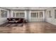 Spacious living room with wood floors, bright windows, and comfortable seating, perfect for relaxation and entertaining at 2617 Mason Ave, Las Vegas, NV 89102