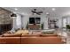Spacious living room with a stone fireplace, hardwood floors, and modern furnishings at 2617 Mason Ave, Las Vegas, NV 89102