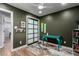 A cozy office space featuring a teal desk and a modern sliding-door closet, illuminated by a ceiling fan and recessed lighting at 2617 Mason Ave, Las Vegas, NV 89102