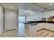 Contemporary kitchen with sleek white cabinets, stainless steel appliances, and a stylish breakfast bar at 2700 Las Vegas Blvd # 505, Las Vegas, NV 89109