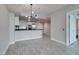 Contemporary living room featuring an open floor plan and a modern light fixture at 2700 Las Vegas Blvd # 505, Las Vegas, NV 89109