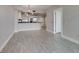 Modern living room with wood floors adjacent to kitchen with stainless steel appliances at 2700 Las Vegas Blvd # 505, Las Vegas, NV 89109