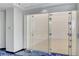Modern racquetball court with glass doors and wood flooring, perfect for staying active and having fun at 2700 Las Vegas Blvd # 505, Las Vegas, NV 89109