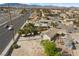 Desert home with desert landscaping, carport, in an urban setting with mountains in distance at 2821 Geist Cir, Las Vegas, NV 89115