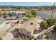 An aerial view of a home with carport, driveway, and desert landscaping in a neighborhood setting at 2821 Geist Cir, Las Vegas, NV 89115