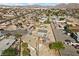 Aerial view of a desert home with mature palm trees surrounded by a residential neighborhood at 2821 Geist Cir, Las Vegas, NV 89115