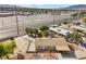 Aerial view of a desert home, carport, desert landscaping, and city street at 2821 Geist Cir, Las Vegas, NV 89115