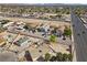 Aerial view of a desert home with mature palm trees surrounded by a residential neighborhood at 2821 Geist Cir, Las Vegas, NV 89115