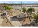 Aerial view of a single-story home with a spacious driveway and detached shed at 2821 Geist Cir, Las Vegas, NV 89115