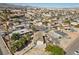 Aerial view of home surrounded by desert landscaping in a residential neighborhood with mountain views in the background at 2821 Geist Cir, Las Vegas, NV 89115