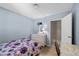 Light-filled bedroom with a spacious desk and entry to attached bathroom at 2821 Geist Cir, Las Vegas, NV 89115