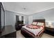 Relaxing bedroom with a wood frame bed and a large window providing natural light at 2821 Geist Cir, Las Vegas, NV 89115
