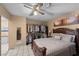 Comfortable bedroom featuring an open closet and a ceiling fan for added comfort at 2821 Geist Cir, Las Vegas, NV 89115