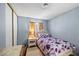 Cozy bedroom featuring a floral patterned bedspread and a work space at 2821 Geist Cir, Las Vegas, NV 89115