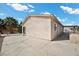 Back exterior view of home showing stucco and concrete with blue skies above at 2821 Geist Cir, Las Vegas, NV 89115