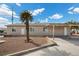Front yard landscape of the home with desert landscaping, palm trees and blue skies at 2821 Geist Cir, Las Vegas, NV 89115