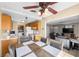 Inviting kitchen with oak cabinets, dining area, and an adjacent living room, ideal for entertaining at 2821 Geist Cir, Las Vegas, NV 89115