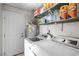 Functional laundry room with modern appliances and shelving for efficient organization at 2821 Geist Cir, Las Vegas, NV 89115