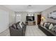 Cozy living room with tile flooring, a TV, and stylish furniture at 2821 Geist Cir, Las Vegas, NV 89115