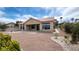 Beautiful backyard featuring desert landscaping, hardscape, and a covered patio at 2904 Bow Bridge Dr, Las Vegas, NV 89134