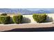 Backyard featuring desert landscaping, a privacy wall, and distant mountain views at 2904 Bow Bridge Dr, Las Vegas, NV 89134