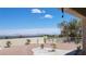 Expansive backyard featuring desert landscaping, mature trees, and panoramic mountain views at 2904 Bow Bridge Dr, Las Vegas, NV 89134