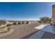 Spacious backyard featuring a gravel area, landscaping, and city views at 2904 Bow Bridge Dr, Las Vegas, NV 89134