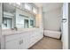 Elegant bathroom with double vanity, marble countertops, and a modern soaking tub at 2904 Bow Bridge Dr, Las Vegas, NV 89134