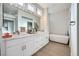 Elegant bathroom with double vanity, marble countertop, stylish fixtures, and a freestanding soaking tub at 2904 Bow Bridge Dr, Las Vegas, NV 89134