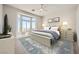 Bright bedroom with large windows, a comfortable bed, and stylish decor at 2904 Bow Bridge Dr, Las Vegas, NV 89134