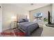 This staged bedroom features a comfortable bed, stylish bedside tables, and a bright window at 2904 Bow Bridge Dr, Las Vegas, NV 89134