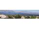 Breathtaking city view showcasing rooftops, lush trees, and majestic mountains in the background at 2904 Bow Bridge Dr, Las Vegas, NV 89134