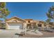 Charming home with a well-maintained front yard and a two-car garage at 2904 Bow Bridge Dr, Las Vegas, NV 89134