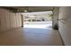 Spacious garage featuring ample built-in storage cabinets and an epoxy floor finish at 2904 Bow Bridge Dr, Las Vegas, NV 89134