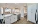 Bright, spacious kitchen with white cabinetry, stainless steel appliances, and luxury countertops at 2904 Bow Bridge Dr, Las Vegas, NV 89134