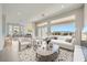 Airy living room featuring stylish armchairs, a comfortable sofa, and great view of the mountains at 2904 Bow Bridge Dr, Las Vegas, NV 89134