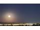 Beautiful night view of a lit city with mountains and the moon at 2904 Bow Bridge Dr, Las Vegas, NV 89134