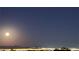 City lights and full moon at night at 2904 Bow Bridge Dr, Las Vegas, NV 89134