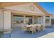 Covered patio featuring an outdoor dining table, chairs, and views of the mountain landscape at 2904 Bow Bridge Dr, Las Vegas, NV 89134