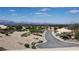 The elevated street view features beautiful homes, desert landscaping, and amazing mountain views at 2904 Bow Bridge Dr, Las Vegas, NV 89134
