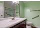 Bathroom with updated sink and vanity, large mirror, and accessible shower at 3062 El Camino Ave, Las Vegas, NV 89102