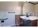 Bathroom with updated vanity, large mirror, and grab bar at 3062 El Camino Ave, Las Vegas, NV 89102