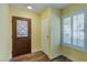 Cozy entryway featuring a leaded glass door, closet, and shuttered window at 3062 El Camino Ave, Las Vegas, NV 89102